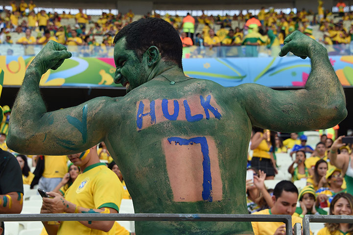World Cup fans: TOPSHOTS  A fan of Brazil's forward Hulk