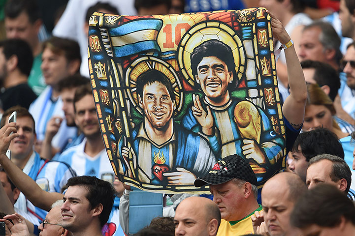 World Cup fans: TOPSHOTS  An Argentina's fan holds an im