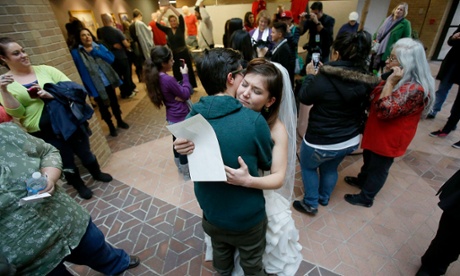 Jax and Heather Collins embrace after getting married at the Salt Lake County Clerk's Office in Utah.