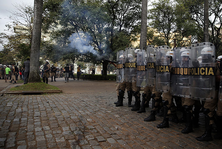 20 Photos: Police officers take their positions during a protest in Belo Horizonte