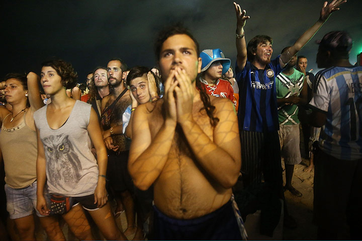 20 Photos: Argentina fans watch the semi-final against Holland on Copacabana Beach