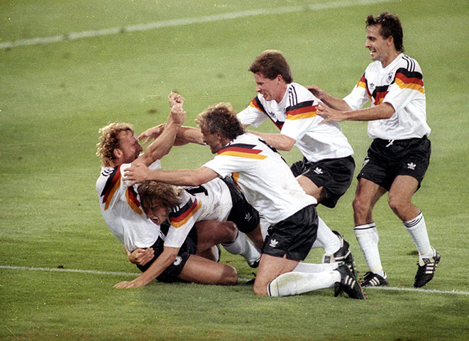 1990 world cup final: West Germany's Andreas Brehme is mobbed by his teammates.