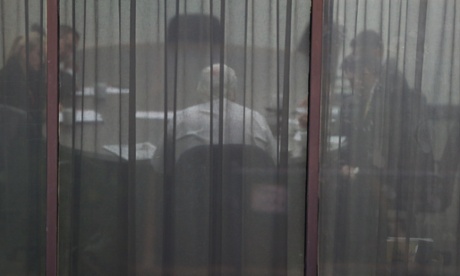 PUP leader Clive Palmer (back to camera) at a meeting at their press club offices this morning to discuss the final amendments to the carbon  repeal legislation, Monday 14th July 2014