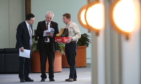 Independent senators John Madigan and Nick Xenophon with the CEO of Rossi Boots Neville Hayward at a press conference this morning, Monday 14th July 2014 in Parliament House, Canberra.