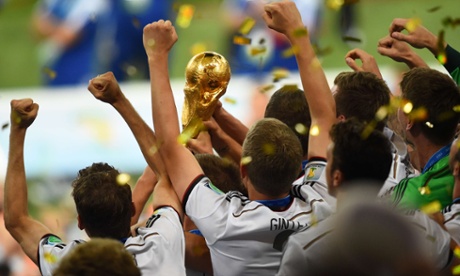 Germany's players hold the World Cup trophy aloft.