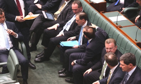 The Prime Minister Tony Abbott congratulates Environment Minister Greg Hunt after the passage of the Carbon tax repeal amendments this evening, Monday 14th July 2014