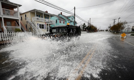 A National Guard humvee travels through high water after Hurricane Sandy