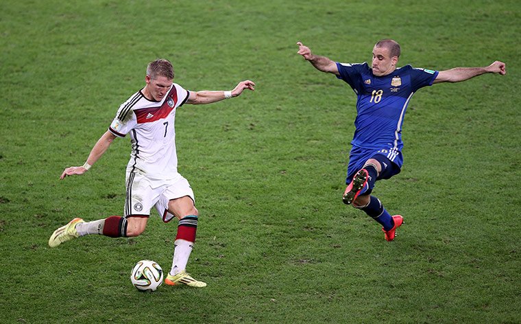 Schweinsteigar's Final: Rodrigo Palacio attempts to block one of Schweinsteiger's lofted passes