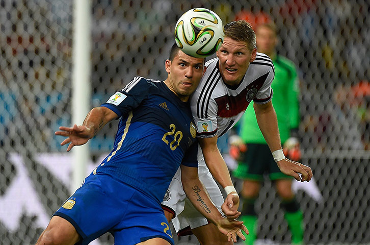 Schweinsteigar's Final: Sergio Aguero and Bastian Schweinsteiger go for a header