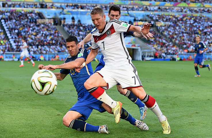 Schweinsteigar's Final: Bastien Schweinstieger is tackled by Martin Demichelis