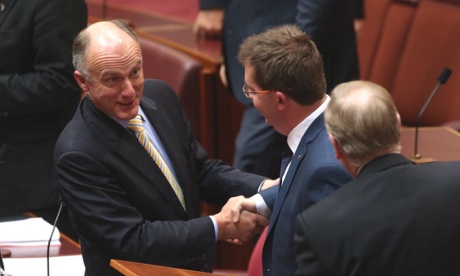 Leader of the Government in the senate Eric Abetz congratulates Queensland Liberal senator James McGrath after he made his first speech in the senate this evening, Wednesday 16th July 2014