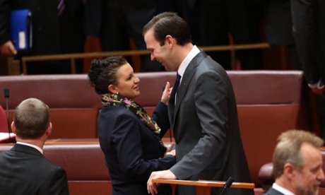 Queensland Nationals senator Matthew Canavan is congratulated by PUP senator Jacqui Lambie after making his first speech in the senate this evening, Wednesday 16th July 2014