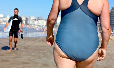 A woman walking on a beach