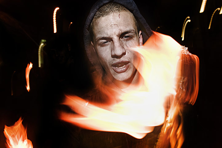 Weekend - Skinheads : skinhead holding a torch during a march in the winter