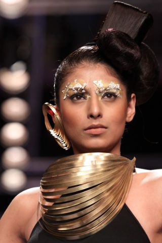 A model wears creations by NID Ahmedabad during the India International Jewellery Week in Mumbai