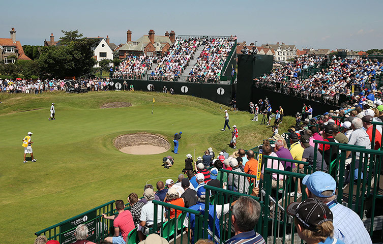 open golf day 1: Rory McIlroy chips onto the 15th 