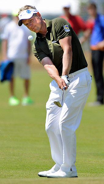 open golf day 1: Luke Donald chips onto the 18th green