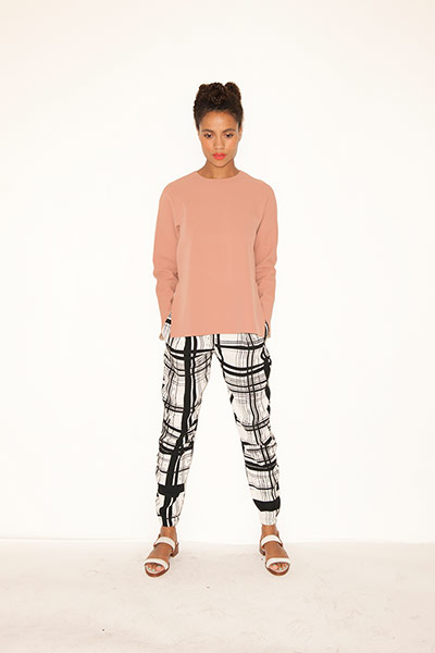 All Ages checks: black white checked trousers apricot coloured jumper white sandals