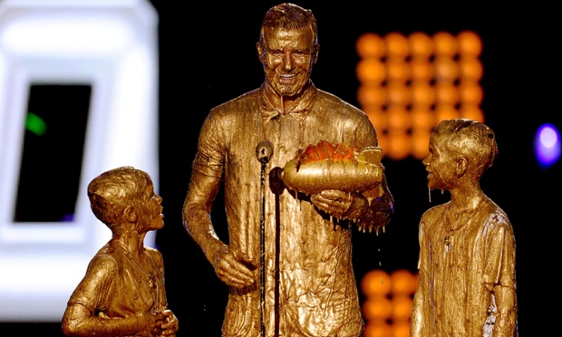 David Beckham with Cruz and Romeo get slimed onstage during Nickelodeon Kids' Choice Sports Awards in Los Angeles, California.