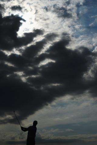 Storm clouds still linger for Zach Johnson of the United States on the third hole during the second round of The 143rd Open Championship in Hoylake, England.