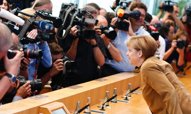 German Chancellor Angela Merkel gets ready for her close up during her annual summer press conference ahead of her holidays.