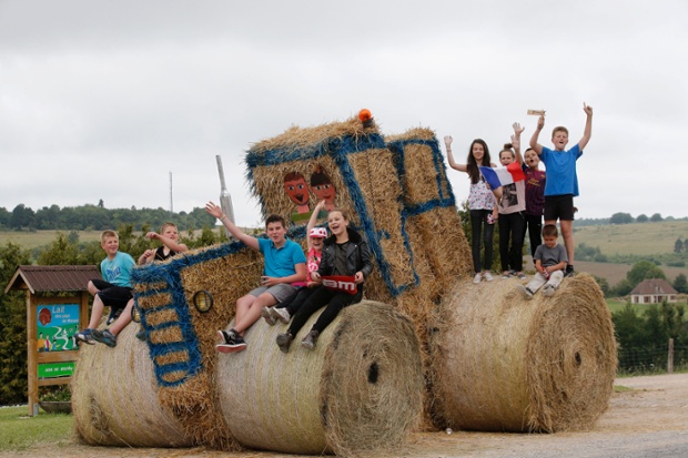 Spectators cheers as they wait for the pack to pass during the seventh stage of the Tour de France cycling race over 234.5 kilometers (145.7 miles) with start in Epernay and finish in Nancy, France.