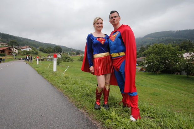 Two people dressed as Superman and Superwoman wait for the riders to pass the eighth stage of the Tour de France cycling race over 161 kilometers (100 miles) with start in Tomblaine and finish in Gerardmer, France.