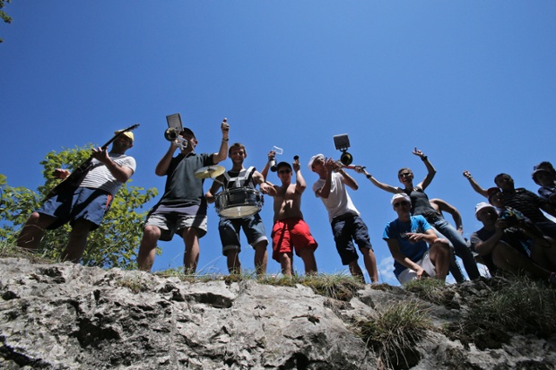 A band plays as the riders pass during the eleventh stage of the Tour de France cycling race over 187.5 kilometers (116.5 miles) with start in Besancon and finish in Oyonnax, France.