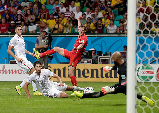 tim howard: Tim Howard makes a save from Belgium's Jan Vertonghen shot on goal