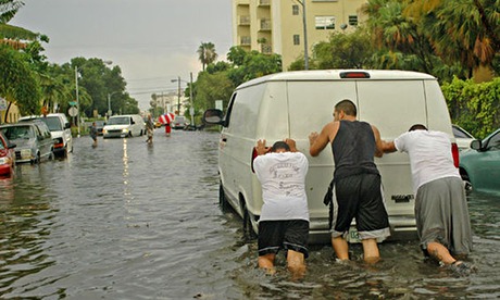 men pushing car miami