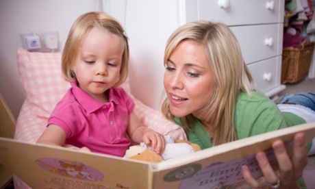 Mother reading with daughter.