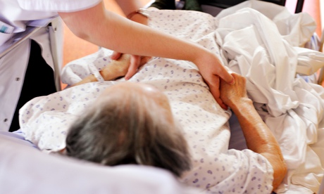 An elderly patient with a healthcare professional