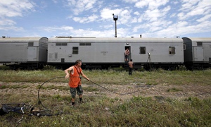 MH17 victims put on refrigerated train  bound for unknown destination