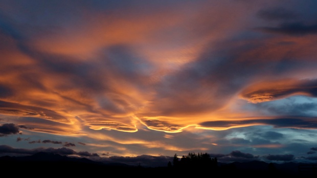 Smoke from fires increases the intensity of the hues during sunset over the Methow Valley in Winthrop, Washington. About 100 homes have been destroyed by the flames.