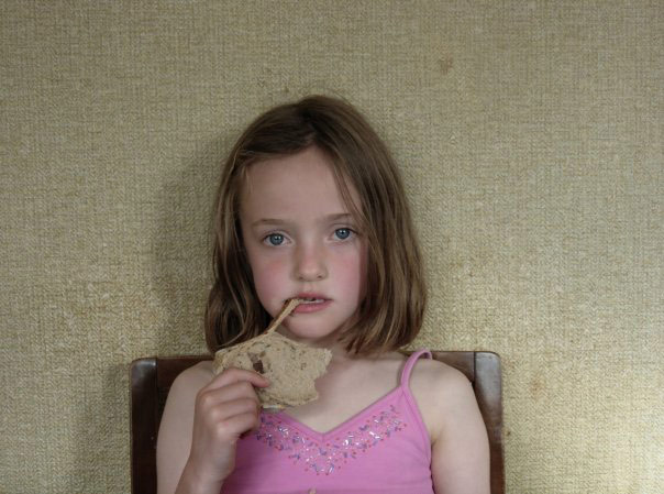 Munch: My sister munching on a slice of walnut bread.