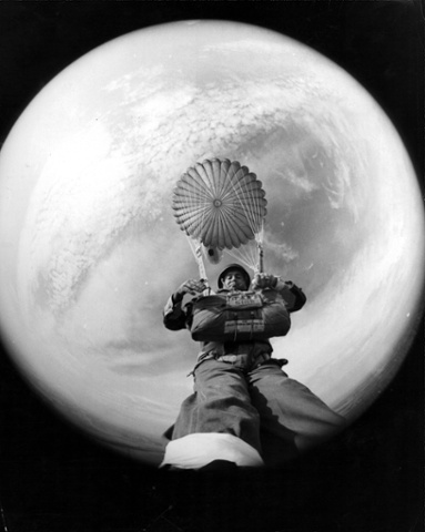 Photojournalist Terry Fincher  with a fish-eye  lens strapped to his foot, 1966