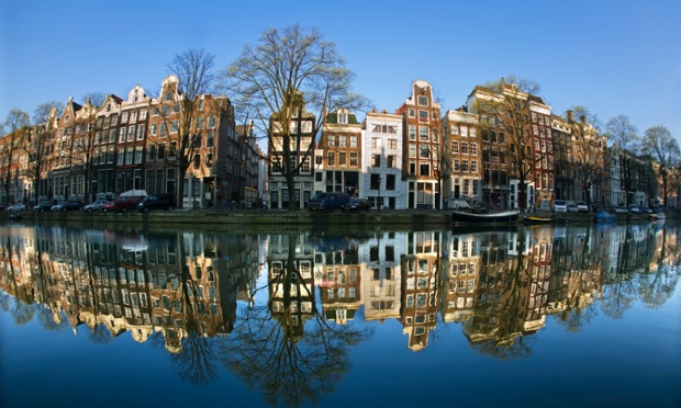 Amsterdam has an architecture that is unmistakeably its own. Stately mansion houses stand sentry along the city’s waterways, their towering stories of brick soaring up to gabled roofs in different designs – all reflected in the calm waters of more than 60 miles (100km) of canals running through the city.