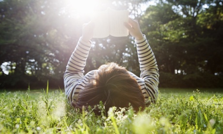 Woman relaxes with a book