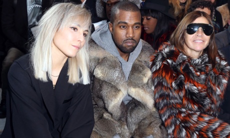 Noomi Rapace, Kanye West and Carine Roitfeld at the Givenchy Menswear show in 2014.