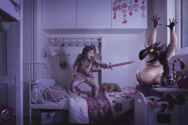 Salome fights a monster with a 'sword' in her bedroom in Laure Fauvel's 'Terreurs', 2014, in Paris, France.