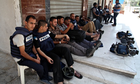 Al-Jazeera journalists evacuate their building in Gaza