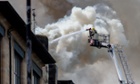 A firefighter tackles the fire at the Charles Rennie Mackintosh building housing the Glasgow School of Art in May.