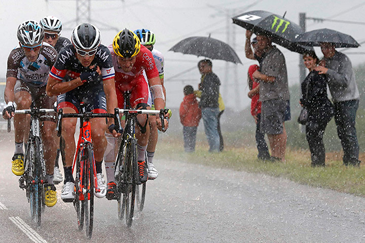 Best TDF 2014: A breakaway group of riders cycle during heavy rain