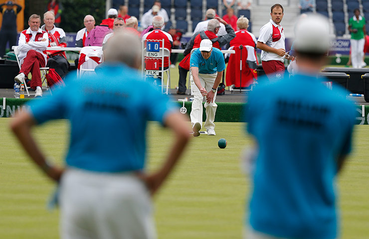 Tom Jenkins day 1: The skip of the Falkland Islands mens triples team Michael Reive bowls 