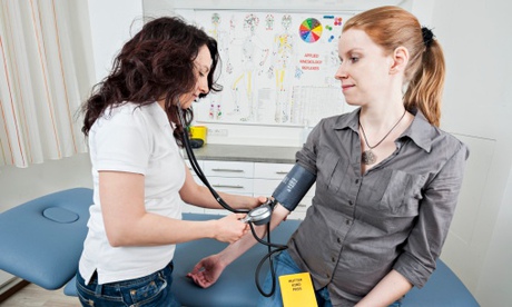 Doctor measuring blood pressure