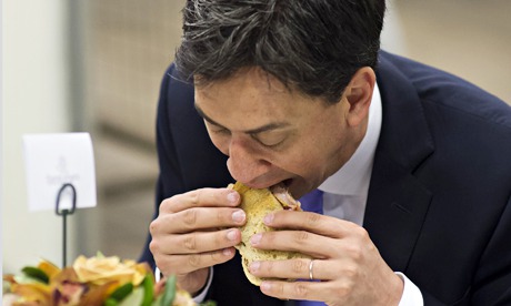 Ed Miliband eats a bacon sandwich during a visit to New Covent Garden Flower Market in May 2014