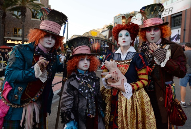 Costume designer and viral marketer Chad Evett (R) and members of his family are dressed as the Mad Hatter outside the San Diego Convention Center on the first day of the 45th annual Comic-Con, in San Diego, California.  The four-day pop culture extravaganza celebrates film, TV, video games, comic books, costumes and other popular arts.