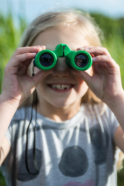 National Trust Hawthorne: National Trust: Poppy Hawthorne with a pair of green binoculars