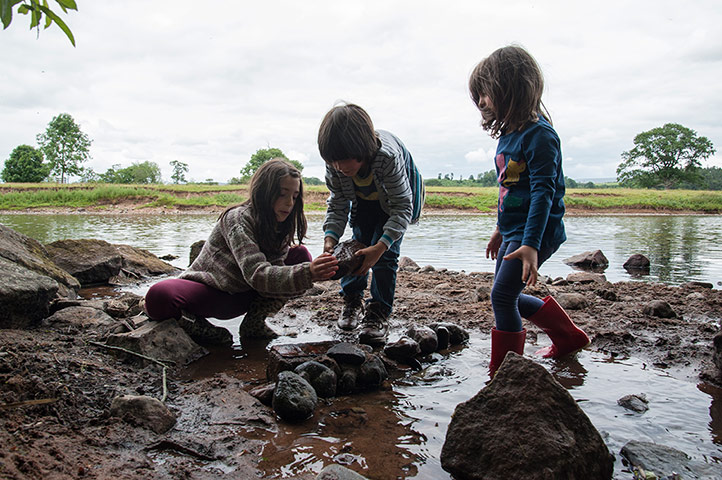 National Trust Loulli: National Trust: the Loulli children at work damming a stream with rocks