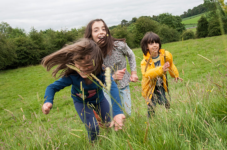 National Trust Loulli: National Trust: the Loulli children run up a hill near Sizergh Castle